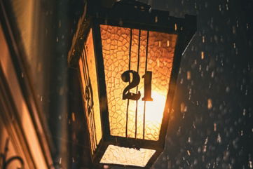 a street light hanging from the side of a building